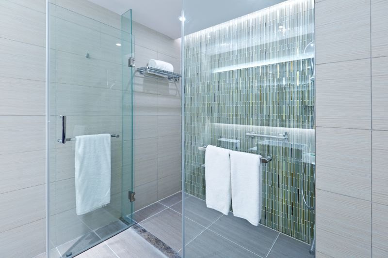 Glass shower door enclosure in a finished bathroom